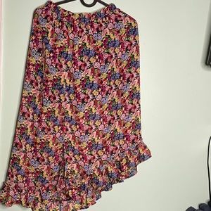 A long flower skirt with multiple colors on it